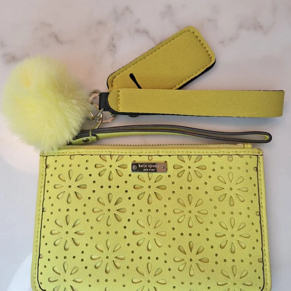 EUC Kate Spade Vibrant Yellow Laser Cut Floral Wristlet Wallet w/ Puff Charm - Picture 1 of 4
